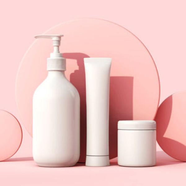 Minimalist skincare product set on pink background